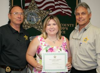 Scholarship recipient Marisa Shivers with father, Hardee County Sheriff's Detective Johnny Shivers (left), and Hardee County Sheriff Arnold Lanier.