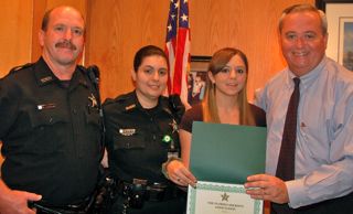 Scholarship recipient Amanda VanDermark with parents (left) Corrections Deputies Scott and Patricia, and St. Johns County Sheriff David Shoar (right).