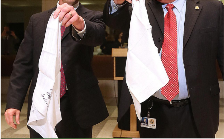 Sine Die. Two men holding white handkerchiefs