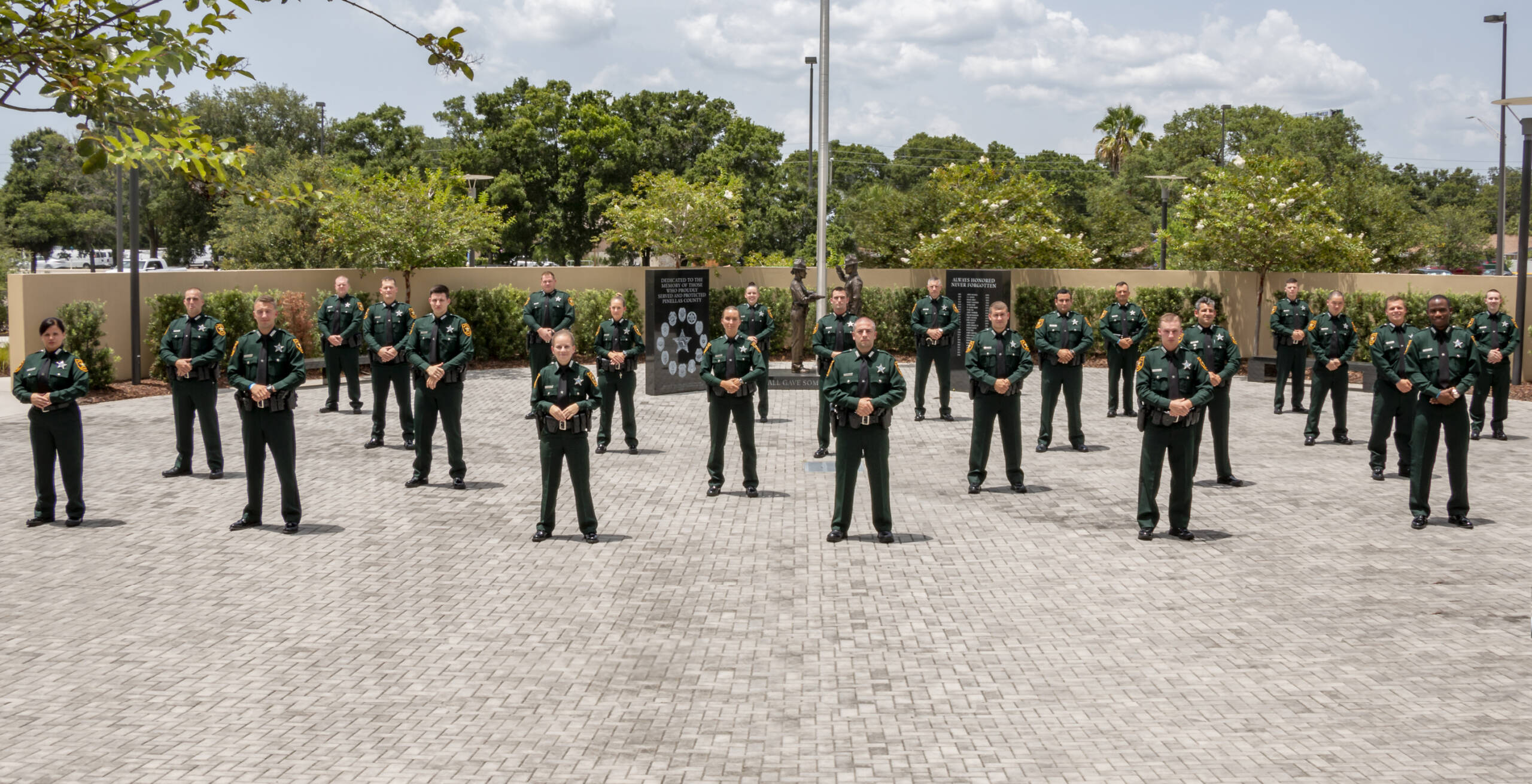 Sheriffs standing at memorial