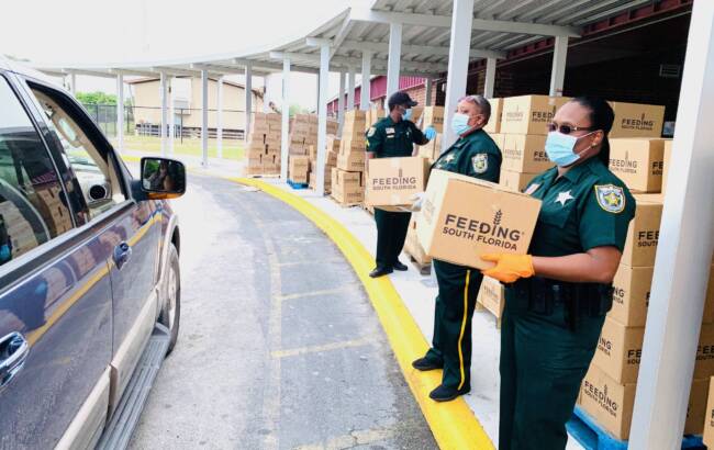 Sheriffs giving away food boxes from feeding florida