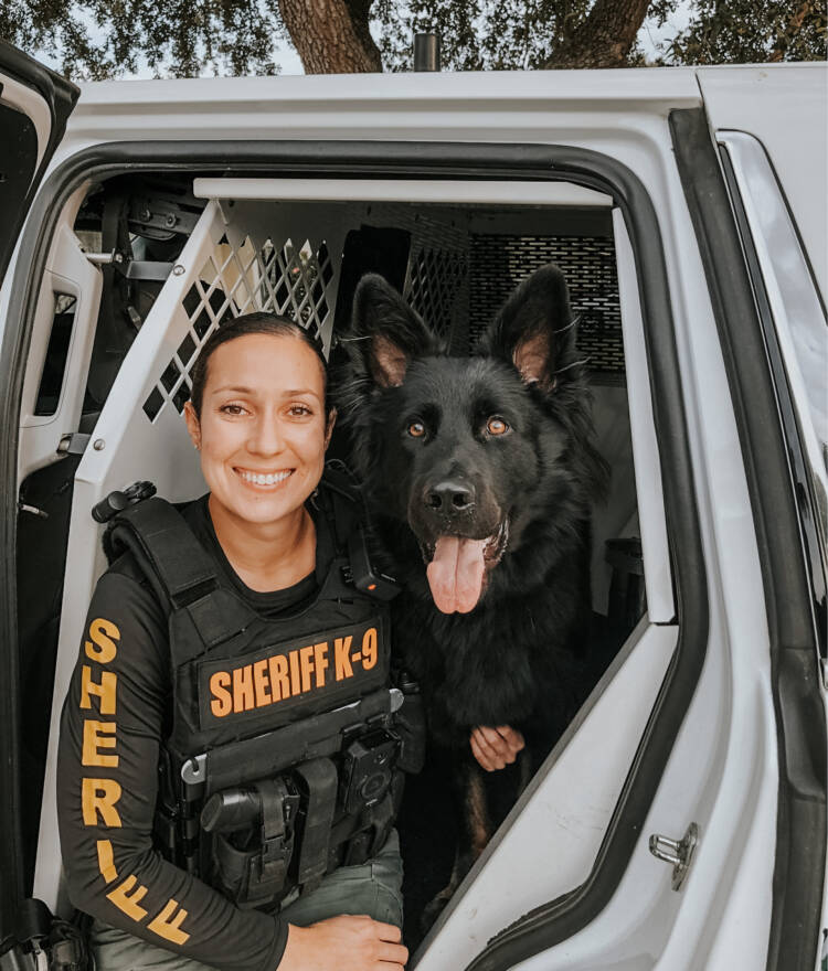 Sheriff with a black dog