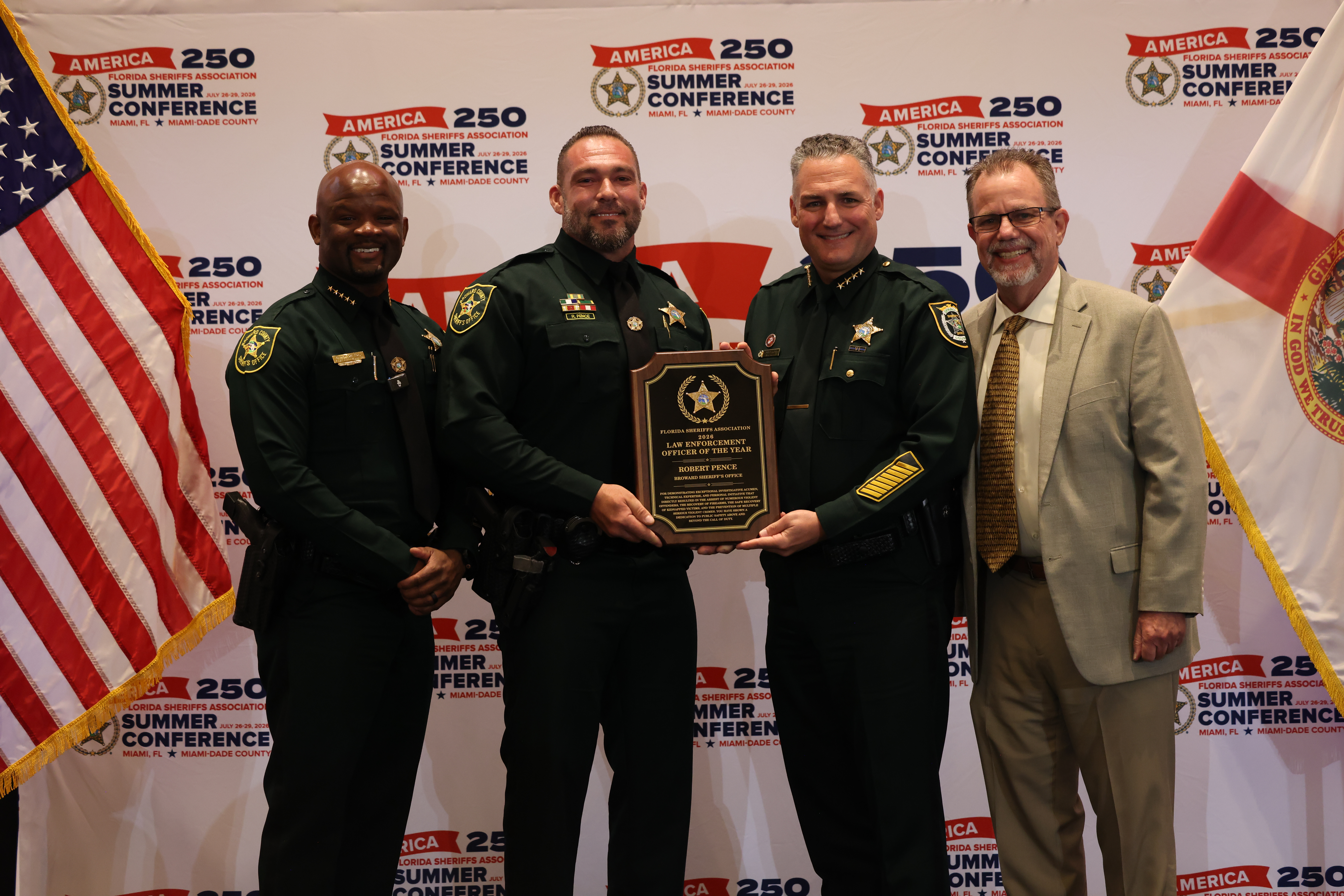Left to Right: Broward Sheriff Dr. Gregory Tony, award winner Detective Robert Pence, FSA President Dennis Lemma, and Rob LaVielle, AT&T FirstNet Sales Director.