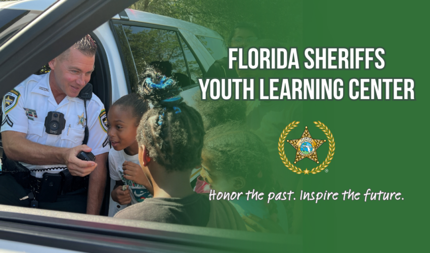 officer with children, Florida Sheriffs Youth Learning Center banner