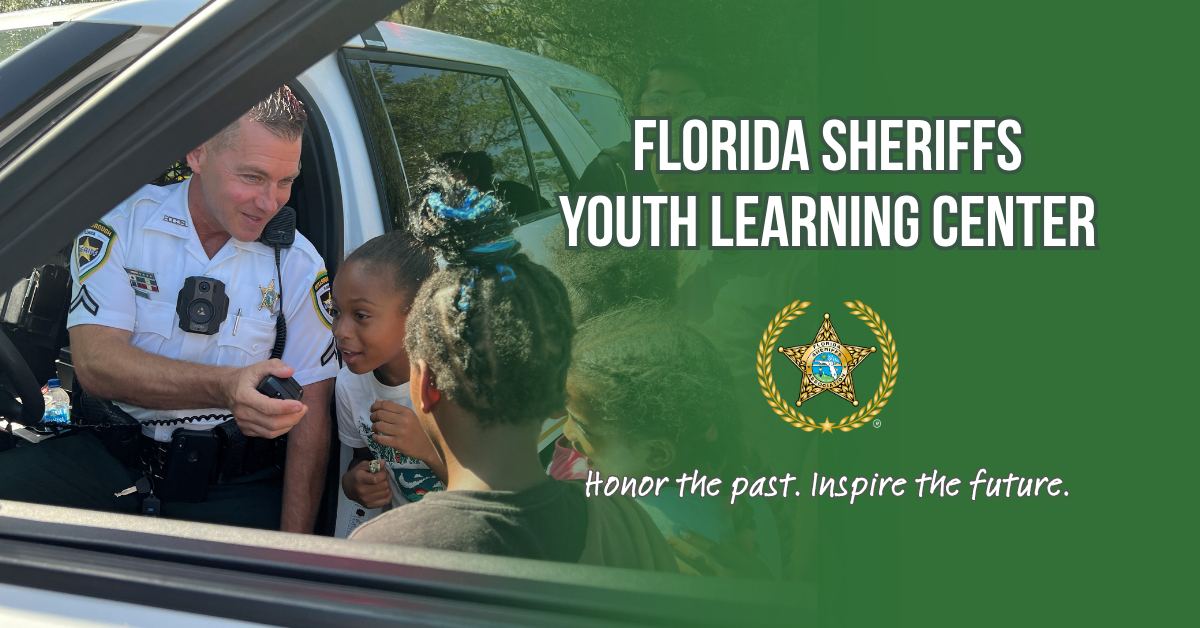 officer with children, Florida Sheriffs Youth Learning Center banner