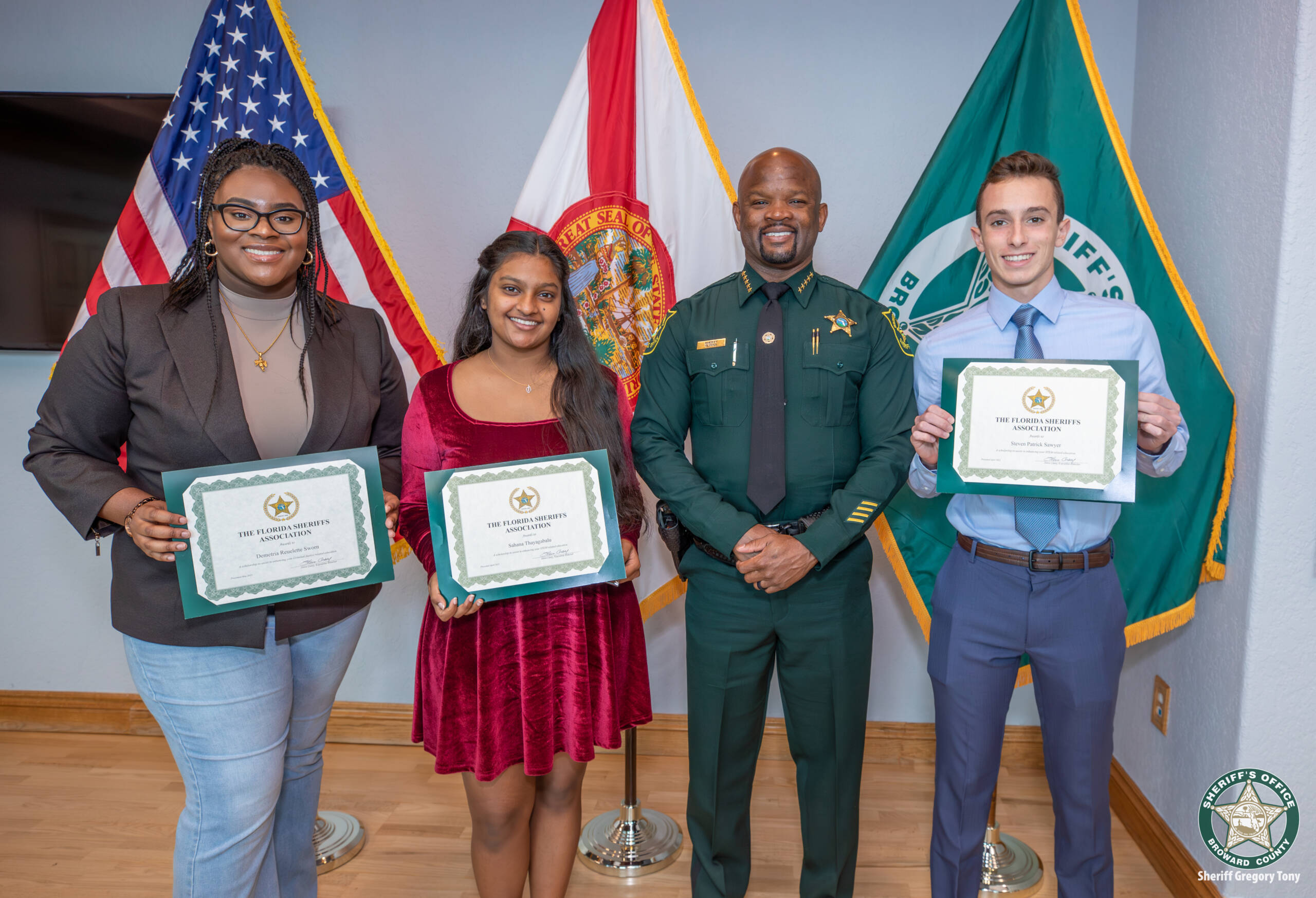 Three scholarship recipients with students