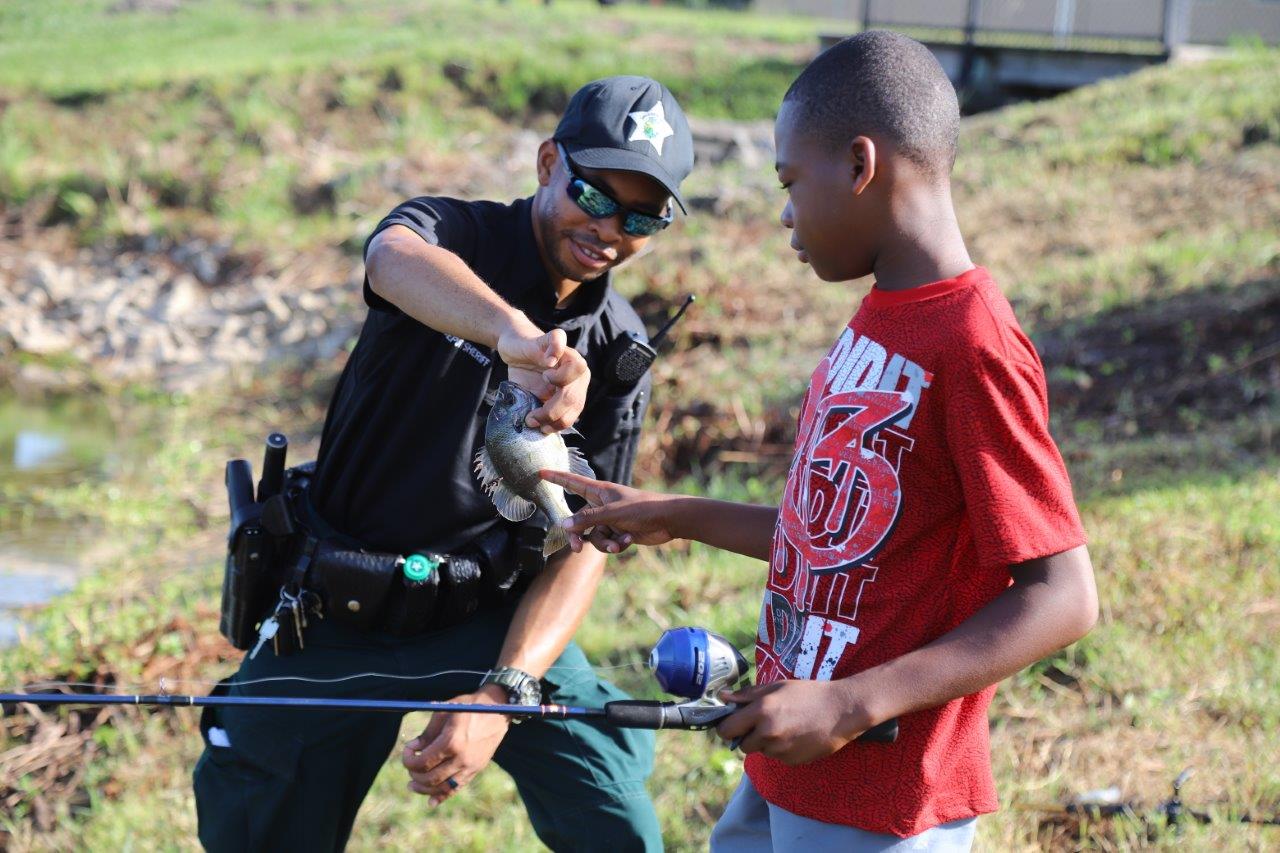 Sheriff fishing with child