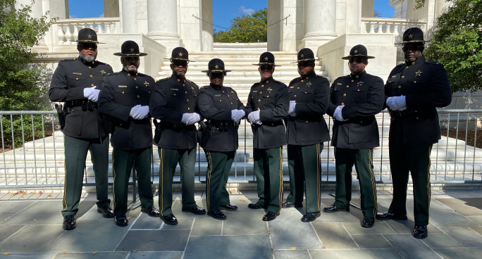 Officers standing at memorial